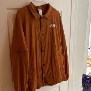 Nike Storm fit Tannish-orange color.
Lightweight Jacket